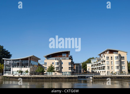 luxury apartment blocks beside the river thames in hampton wick, seen from kingston upon thames, surrey, england Stock Photo