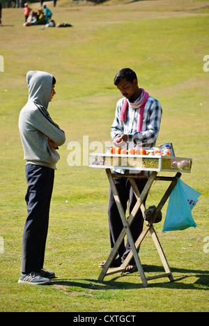 A man selling popular snacks, peanuts, on the meadow of Baisaran, Pahalgam Stock Photo