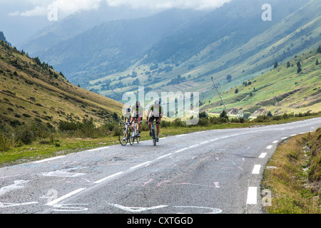 Cyclists on the Tour de France route - the road up the Col du Tourmalet, Haute Pyrenees, France Stock Photo