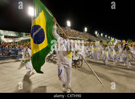 Man with Brazilian Flag while celebrating the Olympics During Carnival Rio de Janeiro Brazil Stock Photo