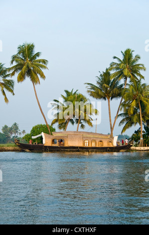 Vertical view of a traditional wooden house boat, kettuvallam, sailing through the backwaters of Kerala. Stock Photo