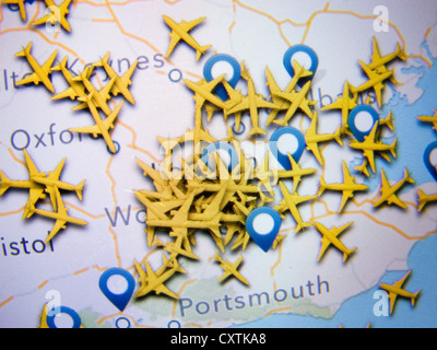 Realtime aircraft radar location many aircraft in congested airspace around Heathrow airport as shown on an app on an iPad Stock Photo