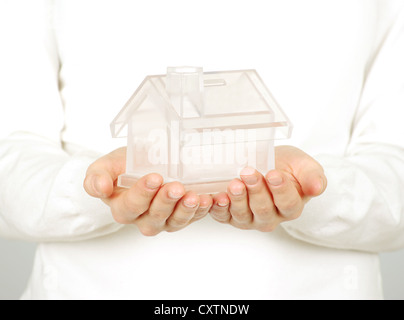 The house in human hands on white Stock Photo