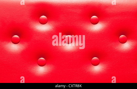 New red leather upholstery as a background image Stock Photo