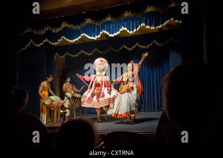 Horizontal wide angle of a Kathakali dance performance inside a theatre. Stock Photo
