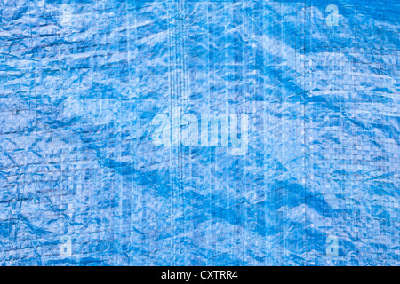 Close up of a blue tarpaulin as a background image Stock Photo
