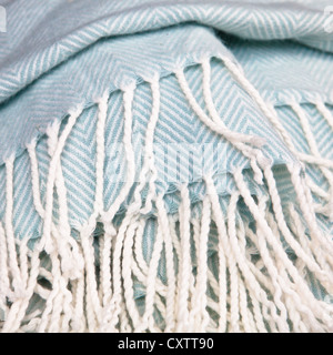 Close up of the tassles of a soft fluffy blanket Stock Photo