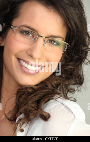 Pretty brunette wearing glasses Stock Photo