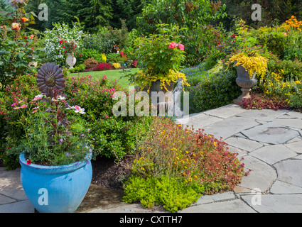 Vashon-Maury Island, WA: Terraced perennial garden with flagstone patio Stock Photo