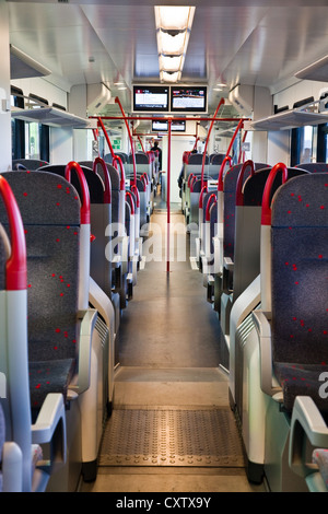 Interior view of a Swiss regional train waiting for passengers at the station of Ins, Switzerland Stock Photo