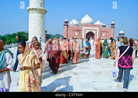 Indian tourists visiting Taj Mahal in colourful traditional dress Stock Photo