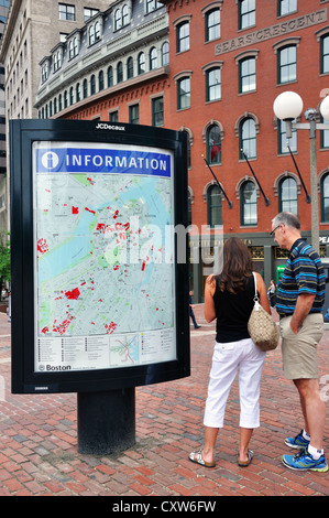 Tourists looking at an information map in Boston, Massachusetts, USA Stock Photo