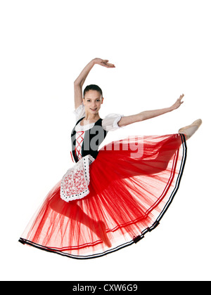 Teenage ballerina in Italian style romantic tutu leaping through the air Stock Photo