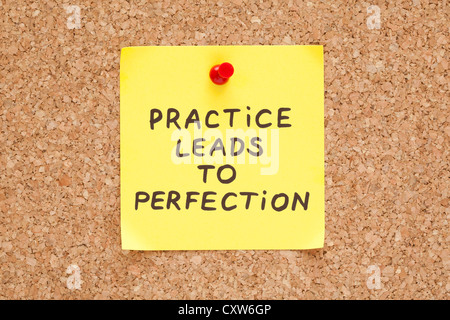 Practice leads to perfection, written on an yellow sticky note on a cork bulletin board Stock Photo