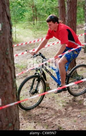 Bicycle driving in extreme competitions in the forest. Stock Photo