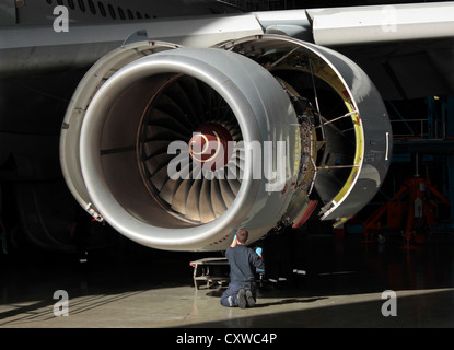 Rolls-Royce Trent 500 jet engine on an Airbus A340-600 airliner undergoing maintenance. Aviation engineering, high value added industry. Closeup view. Stock Photo