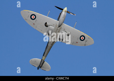 Supermarine Spitfire IX World War 2 fighter plane in flight, climbing and showing off its famous elliptical wings with their curved outline Stock Photo