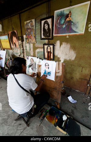 Portrait Artist in the Streets of Jakarta, Indonesia Stock Photo