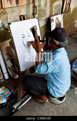 Portrait Artist in the Streets of Jakarta, Indonesia Stock Photo