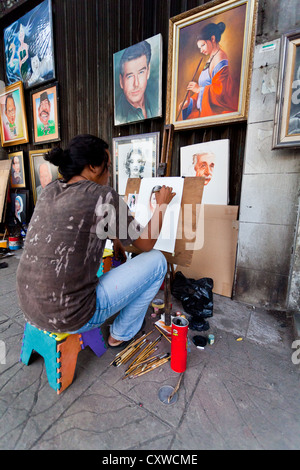 Portrait Artist in the Streets of Jakarta, Indonesia Stock Photo