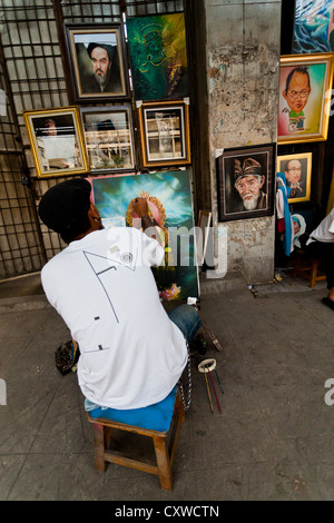 Portrait Artist in the Streets of Jakarta, Indonesia Stock Photo