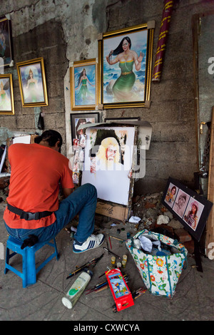 Portrait Artist in the Streets of Jakarta, Indonesia Stock Photo