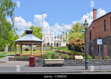View of historic Clunes Town Hall in Victoria, Australia across Collins Place with bandstand facing Fraser Street. Stock Photo
