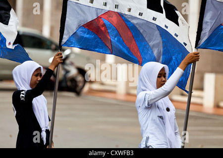 Cheerleaders exercising in the Courtyard of the Istiqlal Mosque in Jakarta, Indonesia Stock Photo