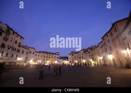 Piazza dell'Amfiteatro at dusk, Lucca, Italy Stock Photo