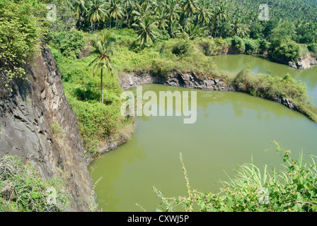 Green Rock Quarry Scenery Top Angle view from Kovalam Tourist Destination at Kerala,India Stock Photo