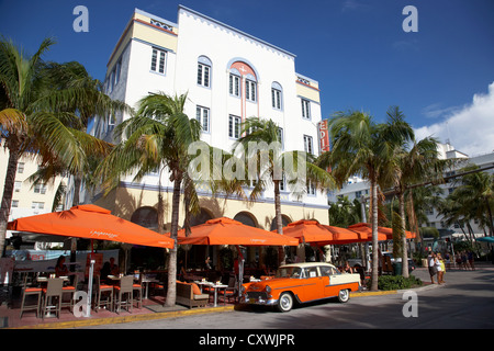 orange chevrolet bel air in the cuban style outside the edison hotel ocean drive in the art deco district of miami south beach Stock Photo