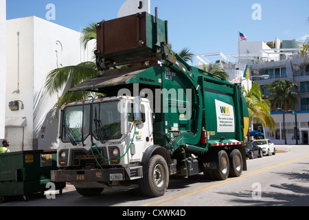refuse truck collecting rubbish bins in miami south beach florida usa Stock Photo