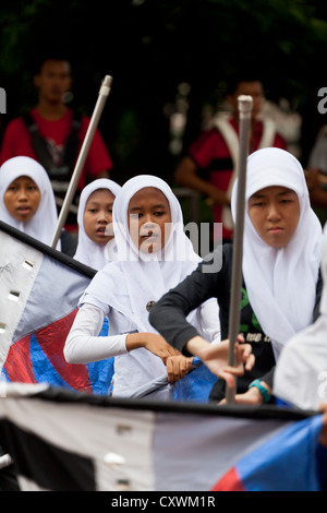 Cheerleaders exercising in the Courtyard of the Istiqlal Mosque in Jakarta, Indonesia Stock Photo