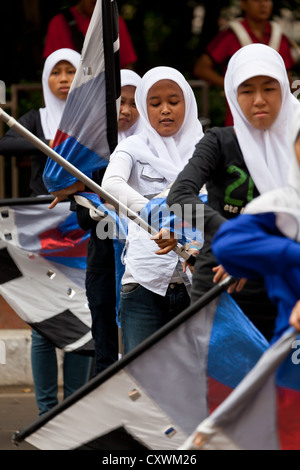 Cheerleaders exercising in the Courtyard of the Istiqlal Mosque in Jakarta, Indonesia Stock Photo