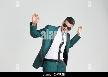 Businessman in sunglasses dancing Stock Photo