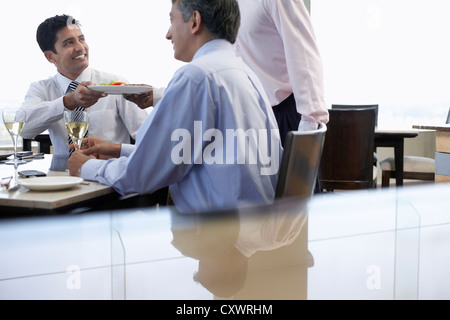 Business people having lunch together Stock Photo