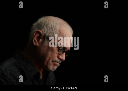 Frowning older man wearing eyeglasses Stock Photo