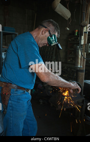 Man working in machine shop Stock Photo