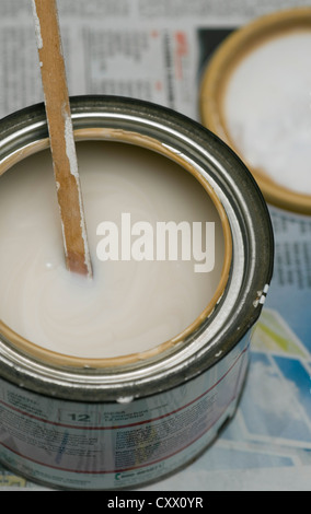 Paint can with wooden stirring stick Stock Photo