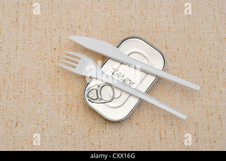 food tin with plastic fork and knife Stock Photo