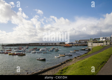 Portrush County Antrim Northern Ireland Fishing boats leisure craft and lifeboat moored in the harbour Stock Photo