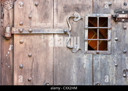 Old stylish door in Polish castle Olsztyn. Gothic style Stock Photo