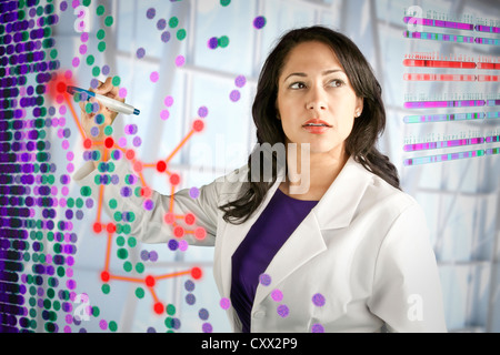 Mixed race scientist working with scientific images Stock Photo
