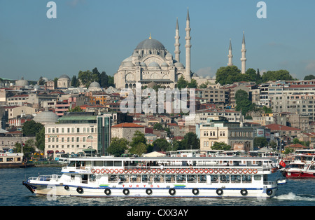 ISTANBUL, TURKEY. A Bosphorus ferry on the Golden Horn, with the Suleymaniye Mosque dominating the skyline. 2012. Stock Photo