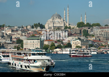 ISTANBUL, TURKEY. Bosphorus ferries on the Golden Horn, with the Suleymaniye Mosque dominating the skyline. 2012. Stock Photo