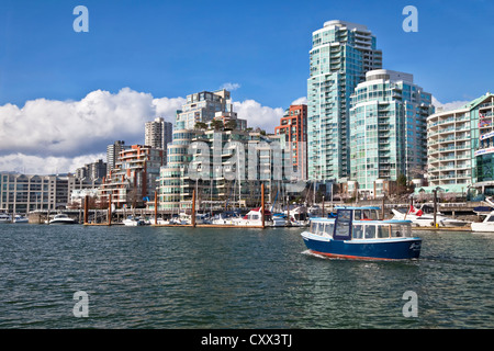 Granville Island Ferry leaving traveling between the waterfront of Vancouver, British Colombia and Granville Island. Stock Photo