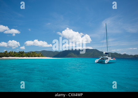 A catamaran and island in Marina Cay of the British Virgin Islands, Caribbean Stock Photo