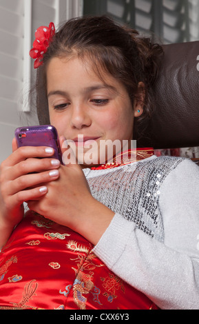 Child,using internet on mobile phone Stock Photo
