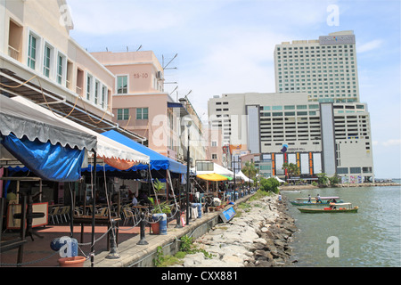 Restaurants overlooking Sulu Sea Sandakan waterfront, Sheraton Four Points hotel beyond, Sabah, Borneo, Malaysia, Southeast Asia Stock Photo