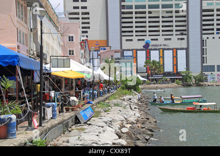 Restaurants overlooking Sulu Sea Sandakan waterfront, Sheraton Four Points hotel beyond, Sabah, Borneo, Malaysia, Southeast Asia Stock Photo